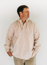 Load image into Gallery viewer, Man wearing striped French Cheesemakers Smock standing in front of white background.