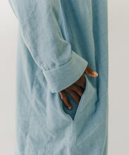 Load image into Gallery viewer, Close up of hand in the pocket of the blue dress. Long sleeve.