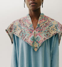 Load image into Gallery viewer, Black woman walking toward camera wearing a long blue dress with an embroidered triangular collar yoke. Close up on the collar with a white background.