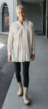 Load image into Gallery viewer, Woman wearing white Croatian Shirt strolls down a sidewalk