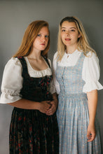 Load image into Gallery viewer, Two young women wearing 123 Austrian Dirndl. Model on left is wearing view B. Model on right is in View A