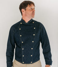 Load image into Gallery viewer, Man wearing a dark blue denim chef's jacket in front of a white background
