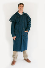 Load image into Gallery viewer, Man standing in front of a white screen wearing a dark blue Drover's Coat.