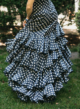 Load image into Gallery viewer, CLose up photo of the Flamenco dress skirt in motion. view is from back and shows the many layers of ruffles.