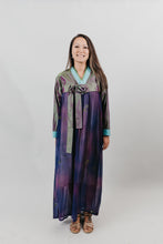 Load image into Gallery viewer, Woman wearing a purple shot silk han bok dress and jacket. Jacket is of teal and green shot silk and tied in the front. She is standing in front of a white backdrop.