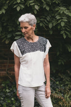 Load image into Gallery viewer, Older woman wearing Old Mexico Blouse outdoors in front of a brick wall with wisteria vines growing behind her.