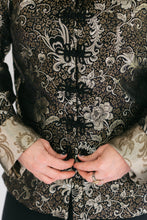 Load image into Gallery viewer, Close up of woman butting loop frog closures on the Chinese Pajama jacket.