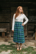 Load image into Gallery viewer, Photo of a young woman standing outdoors wearing the kilt skirt.
