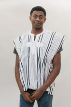 Load image into Gallery viewer, Front view of young African American man standing in front of a white studio backdrop wearing the men's Ghanaian Smock