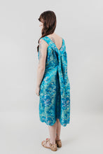 Load image into Gallery viewer, Woman standing with her back to the camera in front of a white backdrop in a sleeveless teal brocade muumuu.