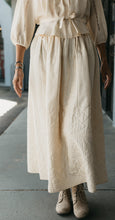 Load image into Gallery viewer, Close up waist down view of woman wearing 206 Quilted Prairie Skirt showing quilted details.