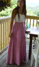 Load image into Gallery viewer, Young Brunette woman standing beside a able on a porch wearing a white spaghetti strapped top and 209 Walking skirt.