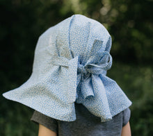 Load image into Gallery viewer, Back view of little girl surrounded by greenery wearing 213 sunbonnet.