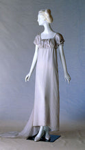 Load image into Gallery viewer, Mannequin with a white studio backdrop wearing 215 Empire Dress the authentic version with a train.
