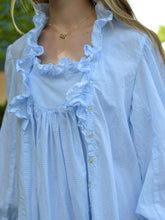Load image into Gallery viewer, Close up of front of blue nightgown with ruffles and buttoned side placket.