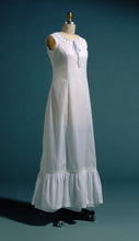 Load image into Gallery viewer, white princess slip on a dress form.