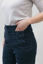 Load image into Gallery viewer, Close of side front view of hand in by the buttoned front of 229 Sailor Pants.