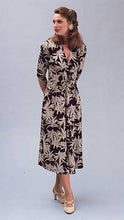 Load image into Gallery viewer, A woman standing on foot in front of the other wearing the 233 Glamour Girl Dress at mid-calf.