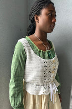 Load image into Gallery viewer, Black woman wearing a cream quilted skirt with a green blouse and white crocheted camisole on top - in front of a grey wall.