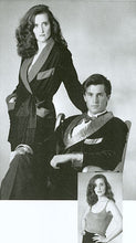 Load image into Gallery viewer, Black and white photo of a woman standing next to a man sitting both wearing 238 Le Smoking Jacket. On the bottom right a woman is standing wearing the knitted tank top.