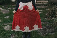 Load image into Gallery viewer, Close up of 243 Rodeo Cowgirl Skirt fanned out with hands surrounded by greenery