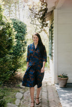 Load image into Gallery viewer, Woman walking surrounded by greenery wearing the 247 Lindy Shirtdress