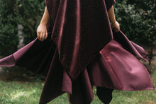 Load image into Gallery viewer, Woman standing surrounded by greenery, Close up of the bottom of the Monte Carlo Dress withe V-Neck Tunic flared.