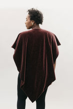 Load image into Gallery viewer, Back view of African American woman with short black hair wearing the Monte Carlo V-Neck Tunic in maroon in front of a white studio backdrop head turned to the left.