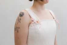 Load image into Gallery viewer, White woman wearing a square neck #267 M' Lady's Corset in white with pink bows on the base of the straps.