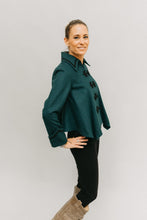 Load image into Gallery viewer, Young blonde white woman turned to the side with right hand on her hip, face turned to the font wearing the Metropolitan Suit jacket.
