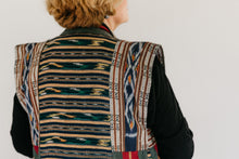 Load image into Gallery viewer, Close up photo of upper back of panel coat. Coat is made in woven ikat fabric.