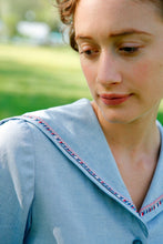 Load image into Gallery viewer, Close up of the Metro Middy Collar in blue with a red, white, and blue trim.