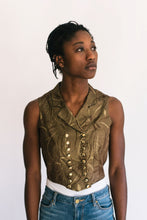 Load image into Gallery viewer, Young African woman standing in front of a white studio back drop looking to the right wearing View C 222 Vintage Vests. With small notched collar plunging into the double breasted front, which closes with two rows of buttons.