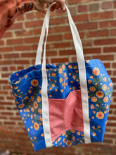 Load image into Gallery viewer, blue floral tote with red pocket and white straps