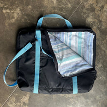 Load image into Gallery viewer, Black briefcase made with blue straps with corner folded down to show lining