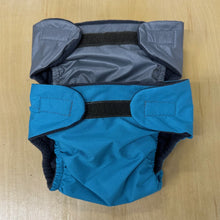 Load image into Gallery viewer, Blue and grey baby diapers with black velcro on a wooden surface