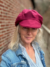 Load image into Gallery viewer, Person wearing a red beret and denim jacket against a brick wall.