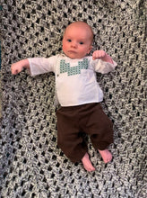 Load image into Gallery viewer, Baby wearing the embroidered Mexican Baby Shirt in white poplin.