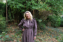 Load image into Gallery viewer, Close up off the top of the Calico Day Dress on a woman standing outside with one hand on her hip.