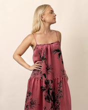 Load image into Gallery viewer, Woman wearing a pink floral dress against a beige background