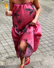 Load image into Gallery viewer, Person wearing a pink floral dress on a paved surface