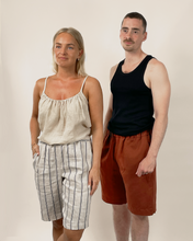 Load image into Gallery viewer, Two people standing side by side against a plain background