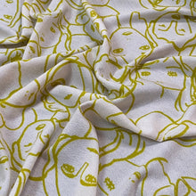 Load image into Gallery viewer, Viscose Crepe Jersey- Crowded Faces- Ochre
