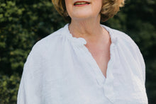 Load image into Gallery viewer, Close up of woman in French Cheesemakers Smock.  Showing the open neck placket
