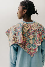 Load image into Gallery viewer, Black woman walking toward camera wearing a long blue dress with an embroidered triangular collar yoke. Close up of back of triangular collar.  On a white background.
