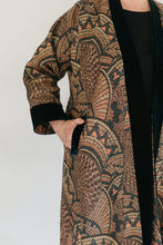 Load image into Gallery viewer, Close up of Turkish coat with view of side pocket.  Model has hand partially in pocket.
