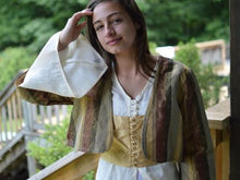 Load image into Gallery viewer, Photo of young woman wearing all three pieces of the 108 Turkish dancer ensemble. Entari (tunic) under, Vest middle layer, Jacket over both layers.  Bell sleeve is highlighted with woman reaching up to touch hair.
