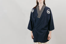 Load image into Gallery viewer, Japanese American woman in a navy Hippari and cream pants standing in front of a white background..
