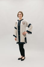 Load image into Gallery viewer, Woman standing in front of white backdrop wearing View C (not quite full length) hand is on hip highlighting sleeve shape.
