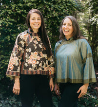 Load image into Gallery viewer, Two women standing side by side outdoors in View A.  Woman on left is in a cotton floral fabric and woman on right is wearing a light green silk jacket.
